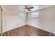 Charming bedroom with wood-look floors and ceiling fan at 10162 115Th Ave, Largo, FL 33773