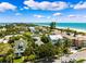 An aerial view of a beachfront community showcasing both water access and proximity to the beach at 106 19Th Ave, St Pete Beach, FL 33706