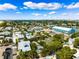 Enjoy this beautiful aerial view of neighborhood homes with views of ocean and the intercoastal waterway at 106 19Th Ave, St Pete Beach, FL 33706