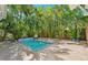 Secluded backyard pool with tropical landscaping, offering a private retreat at 106 19Th Ave, St Pete Beach, FL 33706