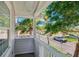 This home includes a charming upper balcony with views of the street and swaying palm trees at 106 19Th Ave, St Pete Beach, FL 33706