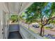 This beautiful balcony has a lovely street view with large mature trees at 106 19Th Ave, St Pete Beach, FL 33706