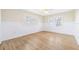 Well-lit bedroom features a ceiling fan, windows and hardwood floors at 106 19Th Ave, St Pete Beach, FL 33706