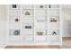 Custom built-in bookcase with decor pieces and ample shelving space at 106 19Th Ave, St Pete Beach, FL 33706