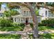 Charming two-story home with a welcoming front porch and lush landscaping at 106 19Th Ave, St Pete Beach, FL 33706