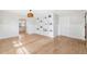 Bright living room with hardwood floors, custom shelving, and natural light at 106 19Th Ave, St Pete Beach, FL 33706
