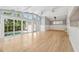 Spacious living area with floor-to-ceiling windows and sliding doors open to the pool at 106 19Th Ave, St Pete Beach, FL 33706