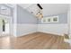 Open living room boasts hardwood floors, high ceilings, and modern light fixtures at 106 19Th Ave, St Pete Beach, FL 33706