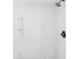 Beautiful tile shower features a shower head and corner shelves for storage at 106 19Th Ave, St Pete Beach, FL 33706