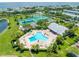 Community pool and tennis courts with surrounding green space at 5005 Coquina Key Se Dr # B, St Petersburg, FL 33705