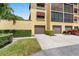 Building exterior showcasing the garage and landscaping at 5775 Park N St # 411, St Petersburg, FL 33709