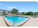 Refreshing community swimming pool with lounge chairs at 5775 Park N St # 411, St Petersburg, FL 33709