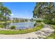 Scenic community lake with a fountain and walking path at 5775 Park N St # 411, St Petersburg, FL 33709
