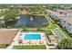 Aerial view of community pool, tennis court, and shuffleboard at 5775 Park N St # 411, St Petersburg, FL 33709