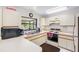Simple kitchen with microwave, coffee maker, and stove at 5775 Park N St # 411, St Petersburg, FL 33709