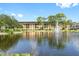 Building exterior showcasing landscaping and a lake at 5775 Park N St # 411, St Petersburg, FL 33709