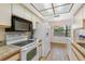 White appliances and granite countertops in this kitchen at 5775 Park N St # 411, St Petersburg, FL 33709