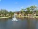 Building exterior showcasing landscaping and a lake at 5775 Park N St # 411, St Petersburg, FL 33709