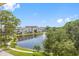 Tranquil pond and walking path with lush landscaping in a resort-like community at 5775 Park N St # 411, St Petersburg, FL 33709