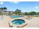 Community pool and spa with surrounding lounge area at 5775 Park N St # 411, St Petersburg, FL 33709