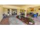 Inviting condo lobby with seating area and landscaped courtyard at 5775 Park N St # 411, St Petersburg, FL 33709