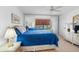 Comfortable bedroom featuring a king-size bed and mirrored closet doors at 5775 Park N St # 411, St Petersburg, FL 33709