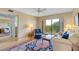 Spacious living room with balcony access and ample natural light at 5775 Park N St # 411, St Petersburg, FL 33709
