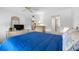 Spacious bedroom with a blue bedspread and built-in dresser at 5775 Park N St # 411, St Petersburg, FL 33709