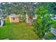 Aerial view of the house, showing its setting in a tree-filled yard at 10162 115Th Ave, Largo, FL 33773