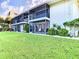Condo building with lush green lawn at 2570 Gary Cir # 3, Dunedin, FL 34698