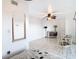 Bright living room with tiled floors, dining area, and a ceiling fan at 2570 Gary Cir # 3, Dunedin, FL 34698