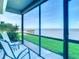 Spacious screened balcony overlooking the water at 2570 Gary Cir # 3, Dunedin, FL 34698