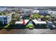 Aerial view showing a condo building, pool, and waterfront location at 2570 Gary Cir # 3, Dunedin, FL 34698