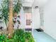 Condo entry with private access and well-maintained landscaping at 2570 Gary Cir # 3, Dunedin, FL 34698