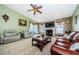 Spacious living room featuring a fireplace and ample natural light at 2014 Montego Ct, Oldsmar, FL 34677