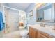 Bathroom with tub and shower combo, vanity, and updated fixtures at 2014 Montego Ct, Oldsmar, FL 34677