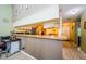 Open kitchen with breakfast bar, stainless steel appliances, and view to dining area at 2014 Montego Ct, Oldsmar, FL 34677