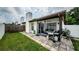 Spacious backyard with patio, grill, and screened porch at 2014 Montego Ct, Oldsmar, FL 34677