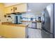 Bright kitchen features stainless steel appliances and ample counter space at 2014 Montego Ct, Oldsmar, FL 34677