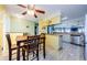Bright dining area with wood table and chairs near kitchen at 2014 Montego Ct, Oldsmar, FL 34677