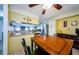 Kitchen and dining area with breakfast bar and a ceiling fan at 2014 Montego Ct, Oldsmar, FL 34677