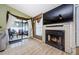 Cozy living room with fireplace and sliding glass doors to patio at 2014 Montego Ct, Oldsmar, FL 34677