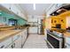 Bright kitchen with stainless steel appliances and wood countertops at 2014 Montego Ct, Oldsmar, FL 34677
