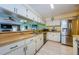 Clean kitchen with stainless steel appliances and wood countertops at 2014 Montego Ct, Oldsmar, FL 34677
