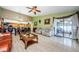 Open living room with access to patio and dining area at 2014 Montego Ct, Oldsmar, FL 34677