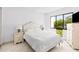 Bedroom with water view and nightstands at 1515 Pinellas Bayway S # 65, St Petersburg, FL 33715