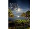 Night view of calm water under a bright moon at 1515 Pinellas Bayway S # 65, St Petersburg, FL 33715