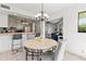 Round dining table with seating for four at 1515 Pinellas Bayway S # 65, St Petersburg, FL 33715