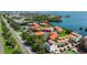 Aerial view showcasing condo location, pool, and tennis court at 1515 Pinellas Bayway S # 65, St Petersburg, FL 33715