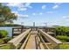 Community dock with seating area, overlooking the water at 1515 Pinellas Bayway S # 65, St Petersburg, FL 33715